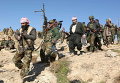 Члены курдских повстанческих сил в городе Синджаре, Ирак