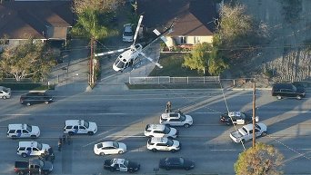 На месте стрельбы в Сан-Бернардино в Калифорнии, где были убиты более 12 человек в центре, который занимается оказанием помощи людям, страдающим умственными расстройствами.