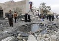 На месте взрыва машины, начиненной взрывчаткой, в районе Новый Багдад