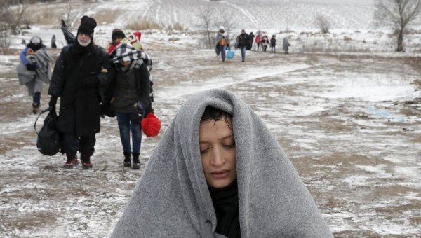 Мигранты с Ближнего Востока после пересечения границы Македонии и Сербии.