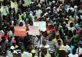 Протестующие на марше в Порт-о-Пренс с требованием отставки президента Гаити Мишеля Мартелли