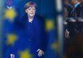 Канцлер Германии Ангела Меркель на фоне флага ЕС