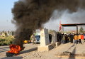 Люди протестуют против нападений ИГ на их деревню близ города Киркук, Ирак