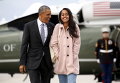 Президент США Барак Обама и его дочь Малия в аэропорту О'Хара в Чикаго