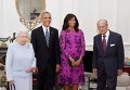 Королева Великобритании Елизавета II и герцог Эдинбургский рядом с президентом США Бараком Обамой и его супругой Мишель в Виндзорском замке