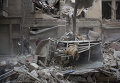 Последствия обстрела сирийского города Алеппо