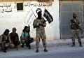 Бойцы оппозиции в отбитом у Исламского государства городе Дабек