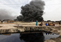 Покидая нефтедобывающий район Кайара в Ираке, боевики Исламского государства поджигали нефтяные скважины