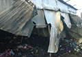 Последствия пожара на рынке у станции метро Лесная в Киеве