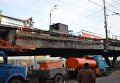 Ремонтные работы на месте обвала Шулявского моста в Киеве