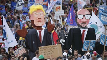 Тысячи человек вышли в Брюсселе на протестные митинги против НАТО и приезда президента США Дональда Трампа.