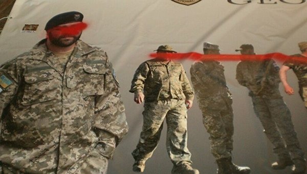 В Харькове залили краской баннер с фото бойцов Грузинского легиона