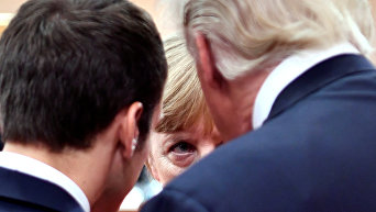 Президент Франции Эммануэль Макрон, канцлер Германии Ангела Меркель и президент США Дональд Трамп. Архивное фото