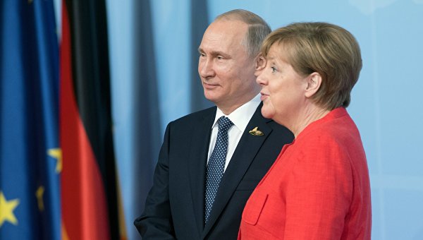 Президент РФ Владимир Путин и канцлер Германии Ангела Меркель на саммите Группы двадцати в Гамбурге