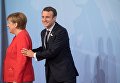 Президент Франции Эммануэль Макрон и канцлео Германии Ангела Меркель на саммите G20 в Гамбурге