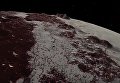 NASA показало как выглядит поверхность Плутона и его спутника Харона. Видео