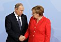 Президент РФ Владимир Путин и канцлер Германии Ангела Меркель