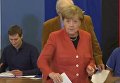 Меркель и ее соперник проголосовали на парламентских выборах в Германии