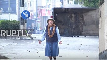 Безоружная пожилая женщина встала между солдатами и протестующими в Вифлееме