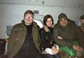 Освобожденные в 2016 году  Владимир Жемчугов и Мария Варфоломеева и Юрий Бирюков в боевом вертолете готовятся встречать пленных