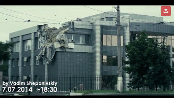Здание в Луганске попало под обстрел. Видео