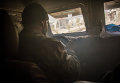 Военнослужащий сирийской армии за рулем бронеавтомобиля в сирийском городе Дарайя, где проходит операция по уничтожению вооруженных экстремистов