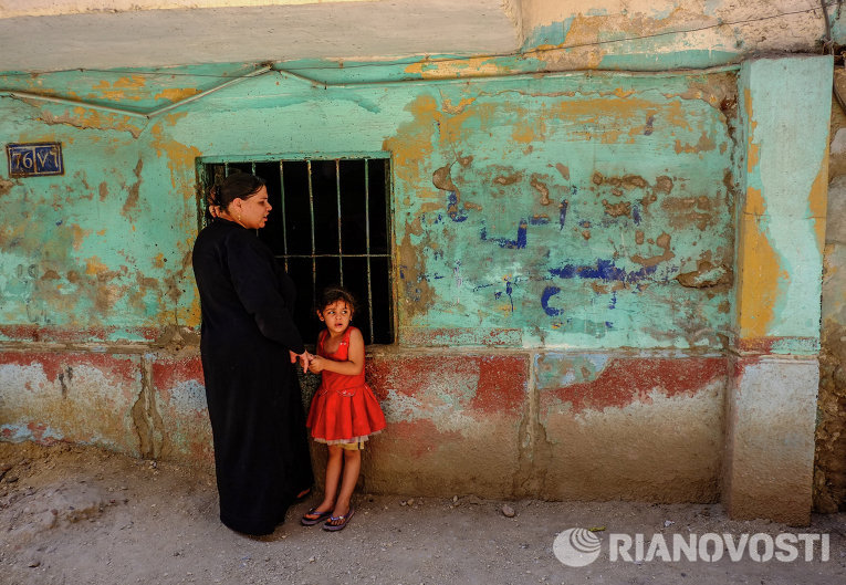 Коптская женщина с ребенком в Минье