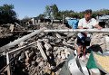 Местная жительница села Коминтерново на развалинах дома