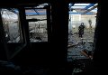 Последствия обстрела градами поселка Красный Пахарь под Донецком