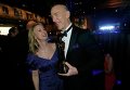 Джей Кей Симмонс с супругой за кулисами премии Оскар, 22 февраля 2015