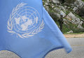 Миротворец на фоне флага ООН. Архивное фото