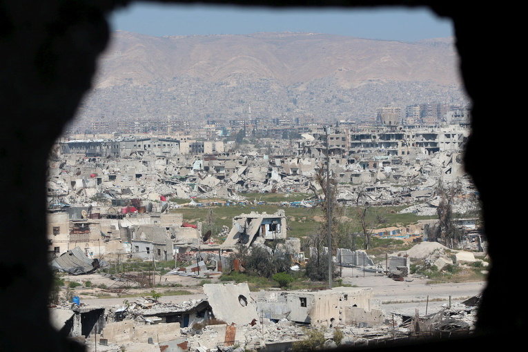 Вид на поврежденные здания в Восточной Гуте в Сирии