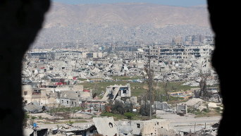 Вид на поврежденные здания в Восточной Гуте в Сирии