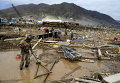Последствия наводнения в городе Чаньяраль в Чили