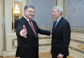 Президент Украины Петр Порошенко и сенатор США Роб Портман во время их встречи в Киеве