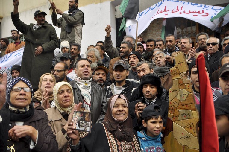 Палестинские беженцы просят оказать помощь пострадавшим в лагере Ярмук