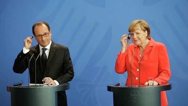 Президент Франции Франсуа Олланд и канцлер ФРГ Ангела Меркель во время пресс-конференции в Берлине