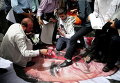 Иранцы топчут портрет президента США Барака Обамы во время акции по иранским ядерным переговорам, после пятничной молитвы в Тегеране