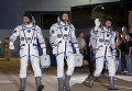Члены экипажа МКС Кьелл Линдгрен из США, Олег Кононенко из России и Кимия Юи из Японии на космодроме Байконур, Казахстан