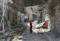 На месте падения военного самолета на жилые дома в городе Эриха неподалеку от Идлиба на северо-западе Сирии