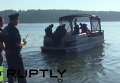 Спасатели на месте падения вертолета и гидроплана в Подмосковье