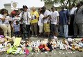 Протесты в Фергюсоне в знак памяти Майкла Брауна - 18-летнего афроамериканца, застреленного белым полицейским