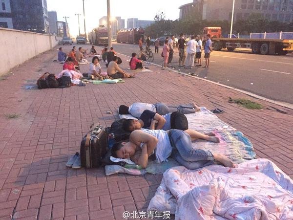 Пострадавшие в результате взрывов и пожара в Тяньцзине (Китай)
