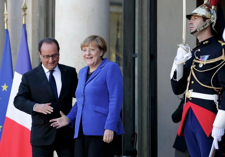 Канцлер Германии Ангела Меркель и президент Франции Франсуа Олланд на встрече нормандской четверки в Париже