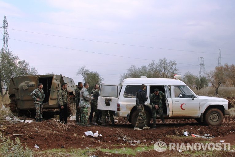Бойцы сирийской армии на позициях в посёлке Шейх-Мискин